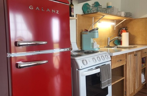 North Lake House | Enchanting pastel mint space created for families adjoining rooms with bathrooms