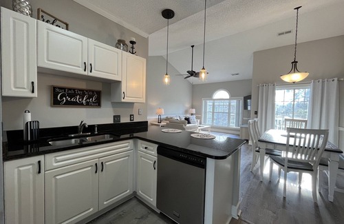 Central Myrtle Beach Condo | Endless Summer Updated Condo at Magnolia Place - Pool & Golf Course Views!