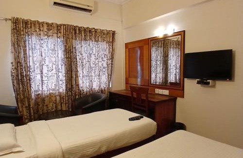 Rajajinagar House | FabHotel Aura Inn - RR Nagar