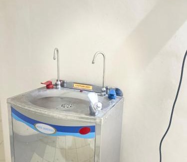 Bukit Kecil House | Family room with private bathroom