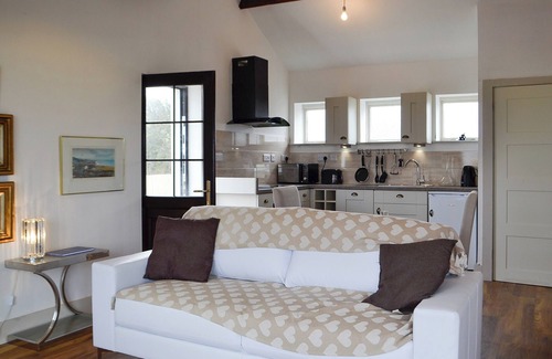 Llansantffraed Cottage | Gorgeous glass fronted property on ground floor level with sea views.