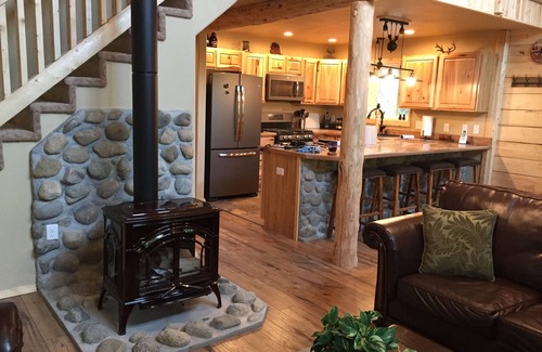 Sutton-Alpine Cabin | Gorgeous Log Cabin With Huge Wraparound Porch