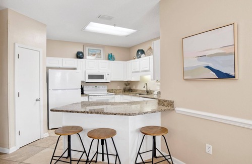 Orange Beach Condo | Ground floor! Steps from the splash pad/beach/grills