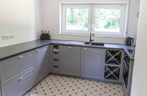 Ebertsbronn Apartment | Haus Grün in a secluded location on the edge of the forest with fenced garden, fireplace and infrared cabin