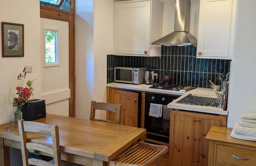 Caerdeon Apartment | Heritage Farm Studio Conversion besides Mawddach Estuary