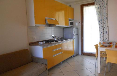 Bibione Lido del Sole Apartment | Holiday village escape with garden and fireplace