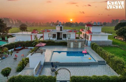 Dhela Villa | Hriday Bhoomi with Pool at Jim Corbett by StayVista