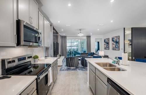 Florida Central Atlantic Coast House | Infinity & Beyond NEW House 7BD, Games RM, Pool,Theater 8 Miles to Disney