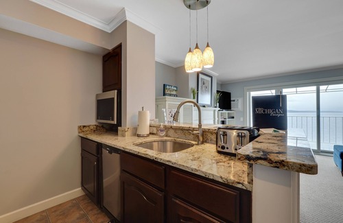 Boyne City Condo | Lake Charlevoix Views from Above | Private Balcony + Beach Access | Fireplace