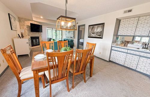 Lake Ozark Condo | Lazy Waves is a 2BR/2BA condo in exclusive Osage Vistas with a large deck overlooking forest views, gourmet kitchen, 1 king, 1 queen, 1 Murphy bed, and access to the lake's largest seasonal pool. Minutes from shopping, dining, and the Strip.