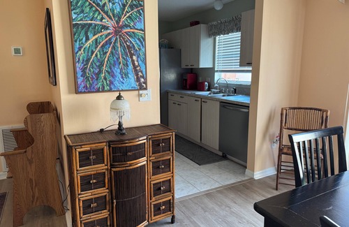 De La Mesa Villa | Lush green patio garden villa, excellent location. Golf cart included!