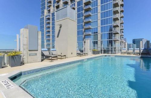 Midtown Apartment | Midtown LuxePad 1B1B with Pool Gym Grills Xbox