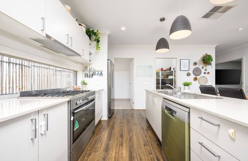 Clyde North House | Modern Family Friendly Retreat Home with Sunroom