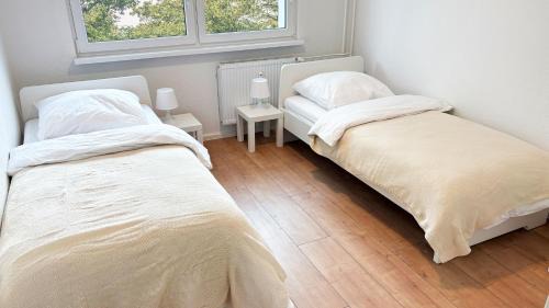 Stadtbezirk West Apartment | Monteurwohnungen mit TV, Internet, Parkplatz, Waschmaschine, Küche, Balkon, Restaurants und Supermarkt