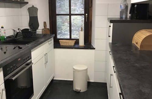 Fronhofen House | Old farm mill with a water wheel rebuilt as a vacation home