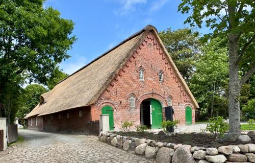 Sievern Apartment | Oolt Huus No 1 I exklusives Wohnen im denkmalgeschützten Reetdachhaus