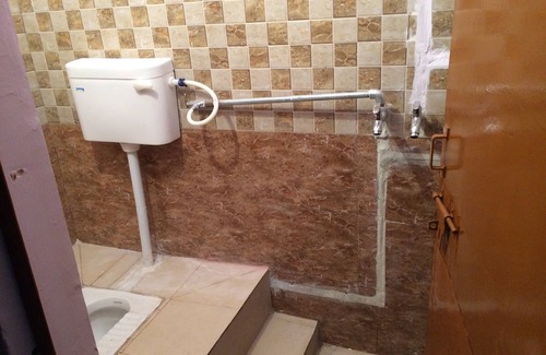 Aliganj House | Open terrace with double bedroom