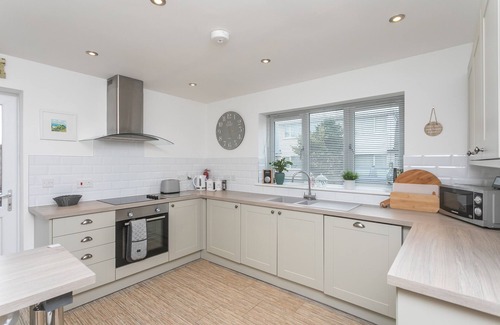 Rhoscolyn House | PINE CONES, with a garden in Four Mile Bridge