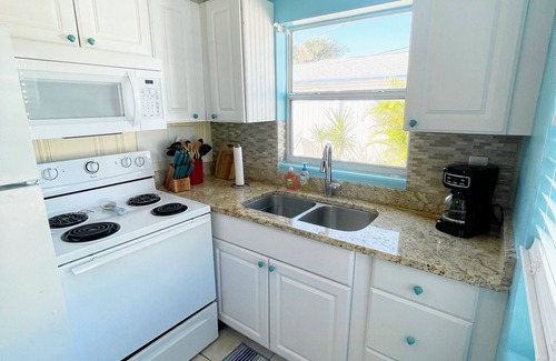 Port Canaveral Cottage | Pool front 1BR w/sun room, 3 min walk to beach