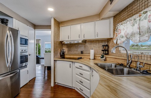 Goodland House | Private Dock, Boats & Bikes Charming Canal-Side Condo w/Screened Porch