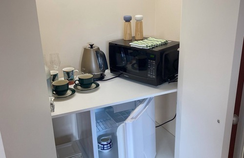 Woodhill Apartment | Private studio with your own waterfall garden and 5 minute walk to Hospital