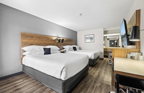 Orchard District Hotel | Relax and Recharge! 3 Comfortable Units! Enjoy Pool Access and Parking On-Site!