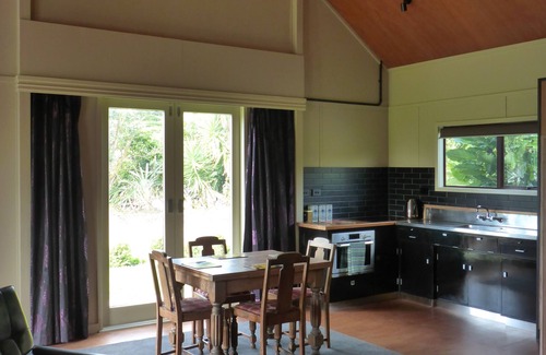 Urenui House | Relax in park-like grounds with outdoor spa.