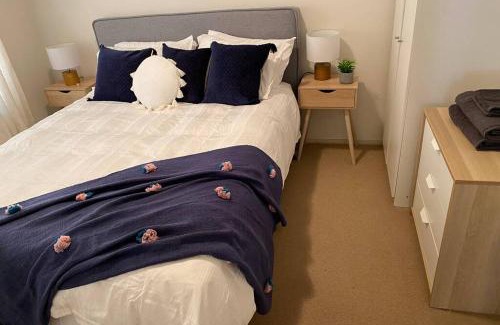 Goughs Bay House | Relax in the spa with views opposite Lake Eildon