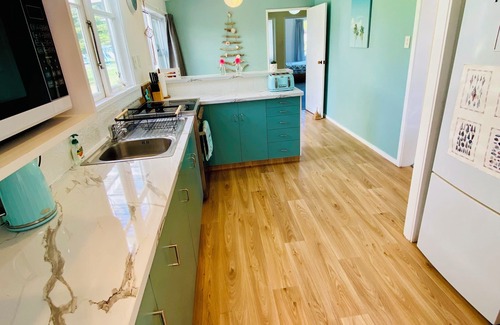 Waikouaiti House | Relaxing cosy 1950's family beach house 1 block back from the beautiful beach.