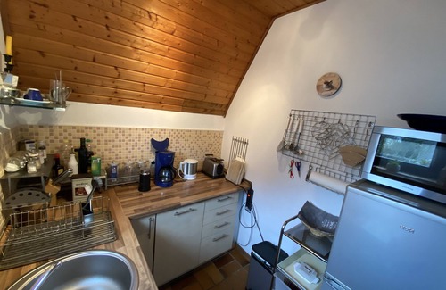 Neufeld House | Roof house with 70m² on two levels with a garden, 150m to the dike