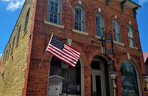 Spillville Apartment | Room 2: Sleep Where Prohibition Secrets Were Made - Historic Escape!