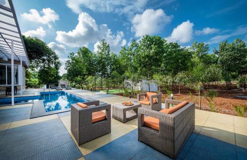 Karjat Villa | SaffronStays Casa De Familia, Karjat - pool villa with ample open space for outdoor games