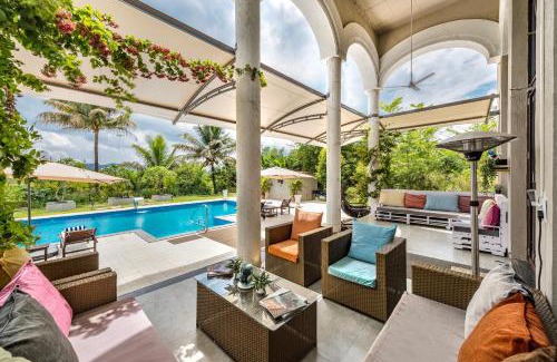 Kadadhe Villa | SaffronStays Zuma Villa, Pawna - luxury villa with a heated pool, sports court and gym