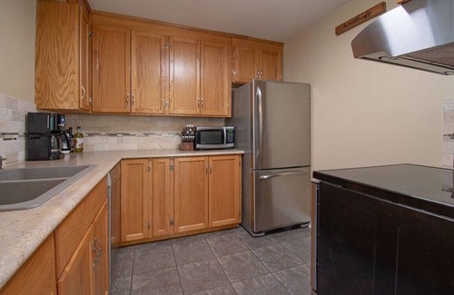 Kearney Cottage | Sand Lake Getaway - Modern Riverfront Cottage w/Swimming & Hot Tub