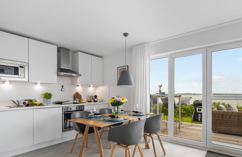 Olpenitz Apartment | Sea view - 1st row on the water, terrace, ground floor, sauna, bathtub, electric grill