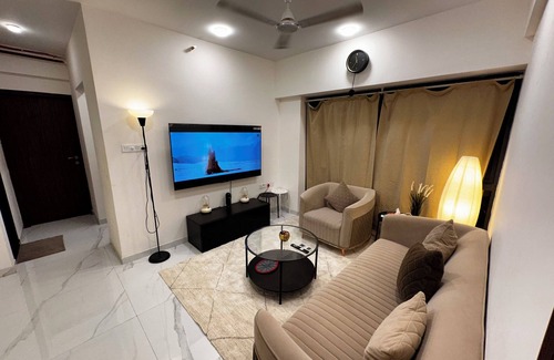 Goregaon West Apartment | Sky Oasis: Premium 2BHK I 65' TV, AC, High Floor, Andheri West
