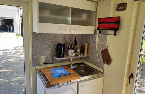 Hagebok House | Small bungalow for two people with a sunny terrace. Near the Baltic Sea.