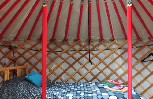 Indian Brook Resort | Small red yurt at Cabot Shores Wilderness Resort