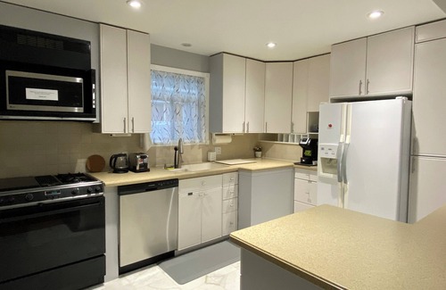 Clairlea House | Spacious 2 bedroom main floor bungalow with parking