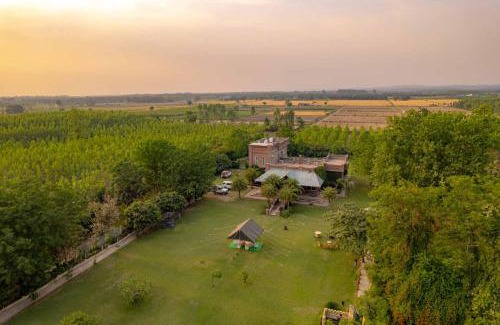 Hoshiarpur Villa | StayVista at Peacocks & Partridges with Amidst Greenery, Terrace, Indoor Fireplace, Bar & Snooker Table