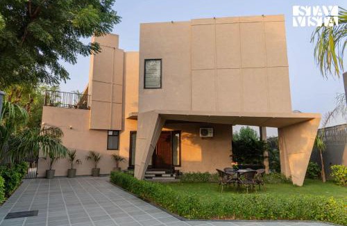 Jaipur Villa | StayVista at Urban Escape - 2 Pools, Lawn & WiFi