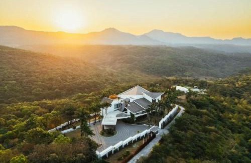 Lonavala Villa | StayVista's Emerald Acres offering a heated pool, bonfire, snooker table, scenic views, tennis court, steam room, gazebo, & gym