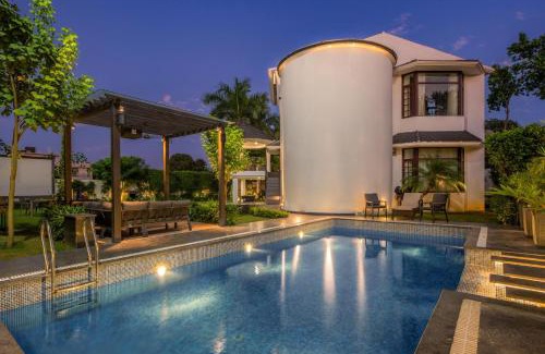 Ludhiana Villa | StayVista's The Secret Lagoon with Outdoor Pool, Verdant Lawn & Indoor-Outdoor Activities