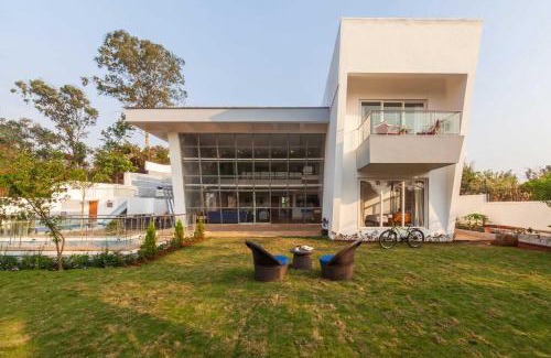 Kune Village Villa | StayVista's White Pebbles - A Villa with Theater Room & Swimming Pool