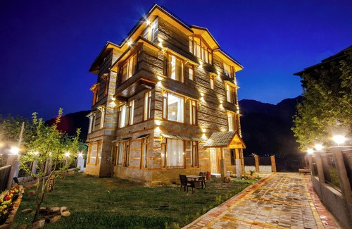 Manali Ski Chalet | Stone and wood cosy chalet admist apple garden with a beautiful law