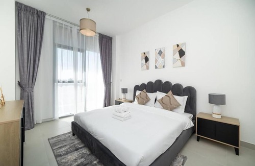 Dubai Investment Park Apartment | StoneTree - Furnished 2BR with floor-to-ceiling window