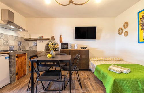 Trinita d'Agultu Apartment | Studio Apartment 'Sa Domo Isola Rossa' with Sea View, Private Terrace and Air Conditioning