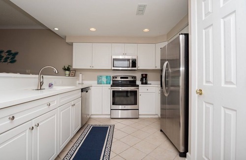 Midtown Ocean City Condo | STUNNING and BAY FRONT - Mid Town -Sleeps 7 in beds w/pool. Walk to the beach!