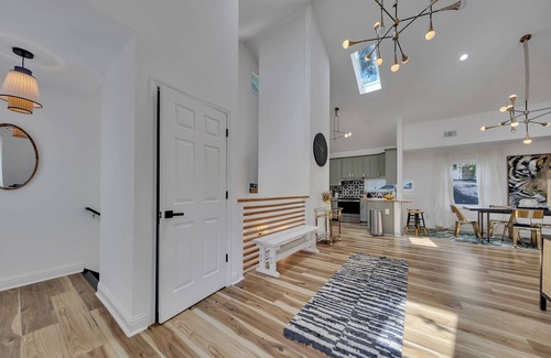 Inman Park Apartment | Stylish 3BR/3BA upper unit in fully remodeled 1920s duplex. Vaulted ceilings, updated kitchen, smart TVs, and private balcony. Perfect for families or groups in walkable Inman Park near BeltLine, dining, and MARTA.
