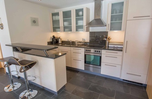 Adelboden Apartment | Stylishly furnished vacation apartment near the mountain railroads.